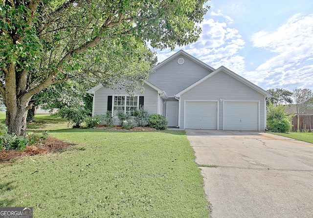 10690 Tara Village Way, Jonesboro, GA 30238 - view of front of home with a garage, concrete driveway, and a front lawn
