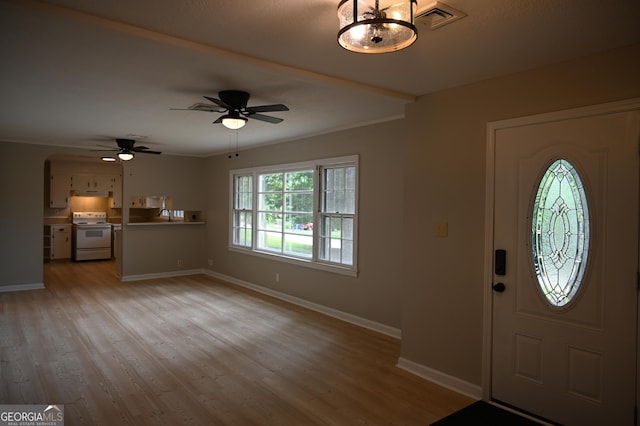 145 Mountain View Dr, Gainesville, GA 30501 - foyer entrance featuring baseboards, light wood finished floors, ceiling fan, arched walkways, and crown molding