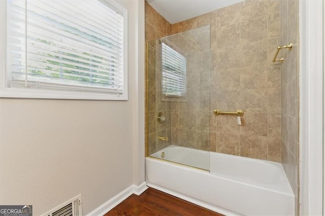 3544 Chestatee Dr, Marietta, GA 30062 - bathroom featuring baseboards, wood finished floors, and shower / washtub combination
