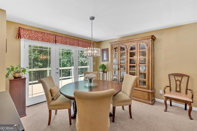 3544 Chestatee Dr, Marietta, GA 30062 - dining room with light colored carpet, a chandelier, baseboards, and french doors