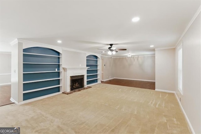 3544 Chestatee Dr, Marietta, GA 30062 - unfurnished living room featuring ceiling fan, crown molding, built in shelves, baseboards, and carpet floors