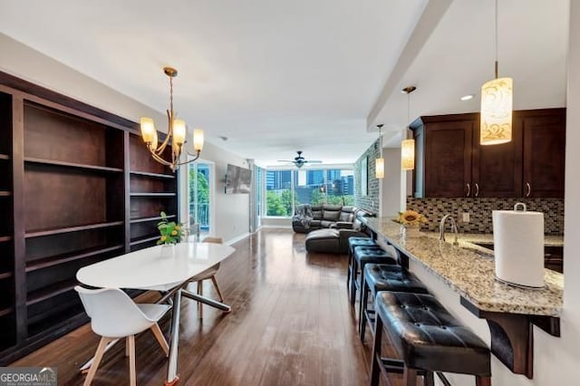 3338 Peachtree Rd NE Unit 508, Atlanta, GA 30326 - dining room featuring a chandelier, dark wood-type flooring, and a ceiling fan