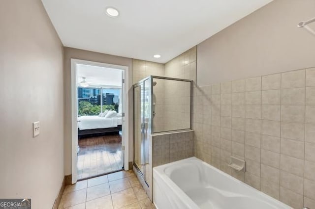 3338 Peachtree Rd NE Unit 508, Atlanta, GA 30326 - bathroom with a garden tub, ensuite bathroom, a stall shower, tile patterned flooring, and recessed lighting