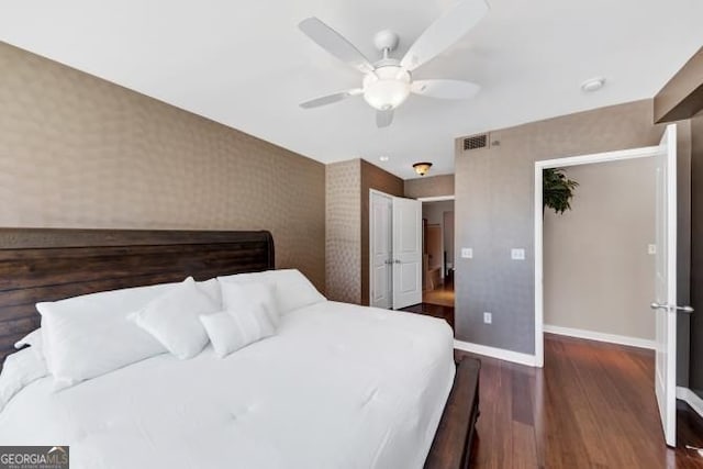 3338 Peachtree Rd NE Unit 508, Atlanta, GA 30326 - bedroom with baseboards, wood finished floors, wallpapered walls, and ceiling fan