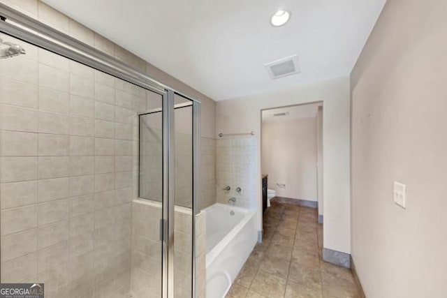 3338 Peachtree Rd NE Unit 508, Atlanta, GA 30326 - bathroom with toilet, a shower stall, a garden tub, tile patterned floors, and baseboards