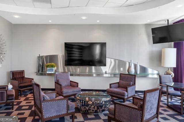 3338 Peachtree Rd NE Unit 508, Atlanta, GA 30326 - living area with carpet flooring, a paneled ceiling, and recessed lighting
