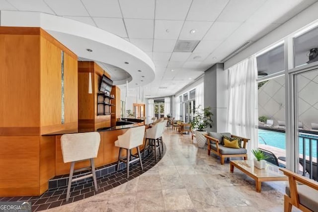3338 Peachtree Rd NE Unit 508, Atlanta, GA 30326 - bar with a paneled ceiling