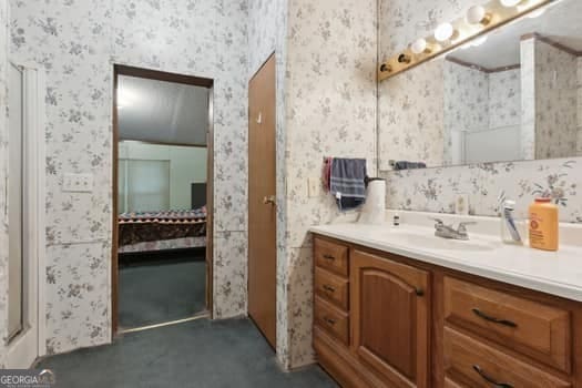 4369 River Rd, Folkston, GA 31537 - full bath featuring wallpapered walls, vanity, and a shower
