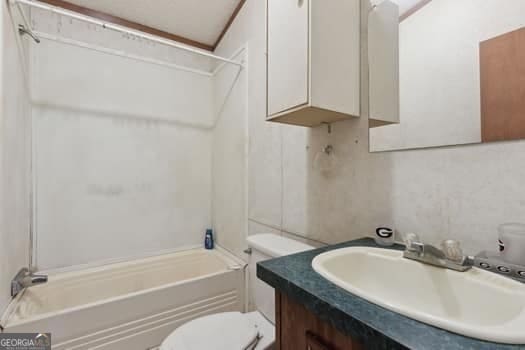 4369 River Rd, Folkston, GA 31537 - bathroom featuring vanity, tub / shower combination, and toilet