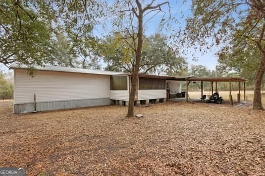 4369 River Rd, Folkston, GA 31537 - rear view of house with an attached carport