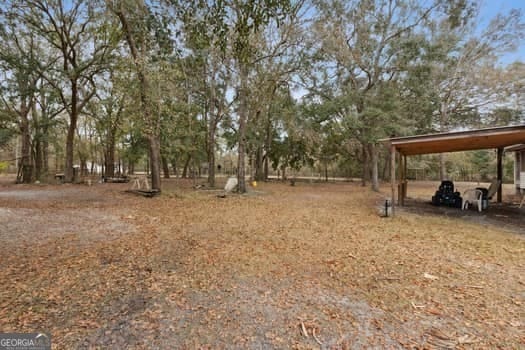 4369 River Rd, Folkston, GA 31537 - view of yard featuring a carport