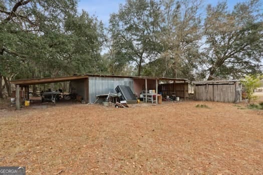 4369 River Rd, Folkston, GA 31537 - view of yard with a carport