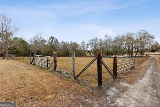 4369 River Rd, Folkston, GA 31537 - gate featuring a rural view