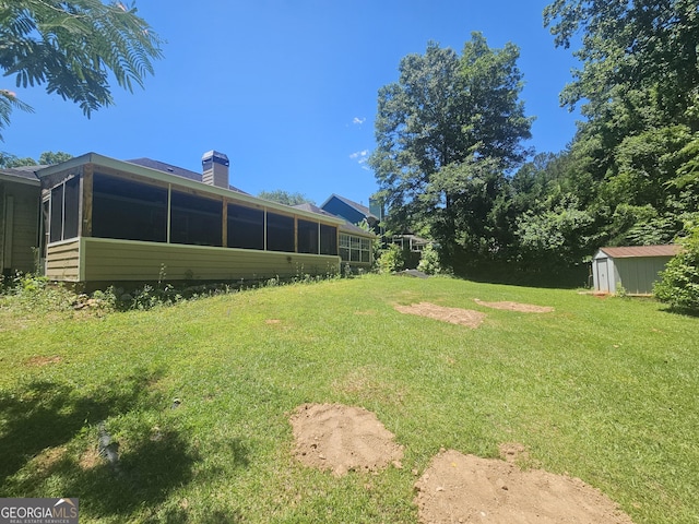 212 Hunting Ct, Jonesboro, GA 30236 - view of grassy yard featuring a sunroom