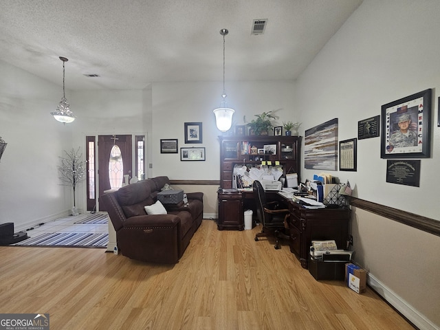 212 Hunting Ct, Jonesboro, GA 30236 - office with light wood finished floors, baseboards, and a textured ceiling