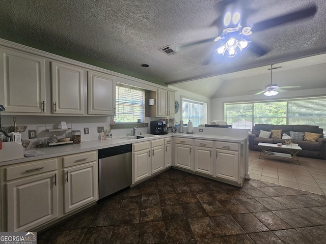 212 Hunting Ct, Jonesboro, GA 30236 - kitchen featuring stainless steel dishwasher, ceiling fan, a peninsula, a sink, and light countertops