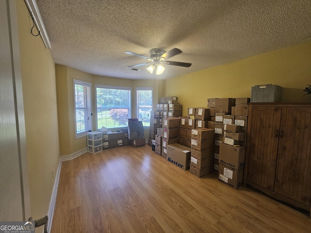 212 Hunting Ct, Jonesboro, GA 30236 - office space with a ceiling fan, light wood-type flooring, a textured ceiling, and baseboards