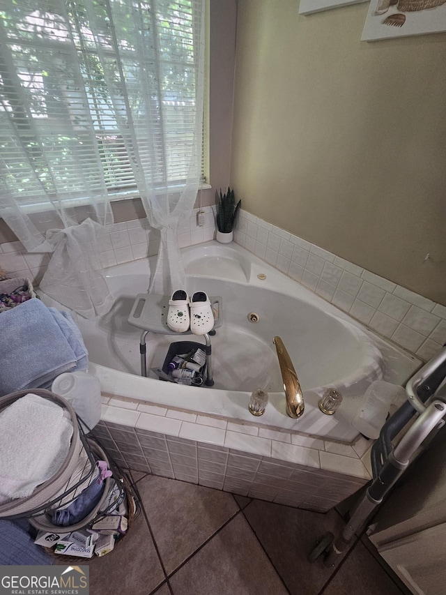 212 Hunting Ct, Jonesboro, GA 30236 - bathroom featuring a whirlpool tub and tile patterned flooring