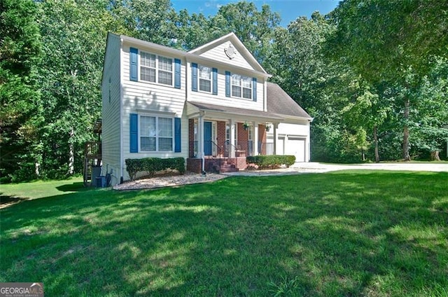 809 Longbranch Ln, Douglasville, GA 30134 - colonial home featuring a garage, a front lawn, a porch, driveway, and view of wooded area
