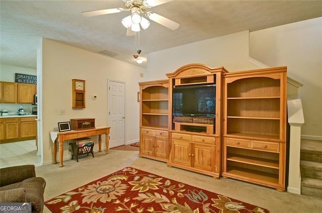 809 Longbranch Ln, Douglasville, GA 30134 - living room featuring light colored carpet, a ceiling fan, baseboards, and a textured ceiling