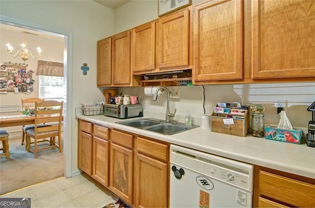 809 Longbranch Ln, Douglasville, GA 30134 - kitchen featuring white dishwasher, a sink, light countertops, a chandelier, and light flooring