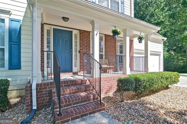 809 Longbranch Ln, Douglasville, GA 30134 - view of exterior entry featuring a porch and brick siding