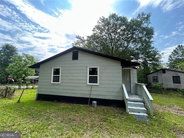 3005 Margaret Dr, Macon, GA 31206 - rear view of property with a lawn