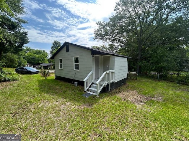 3005 Margaret Dr, Macon, GA 31206 - back of property featuring a lawn and crawl space
