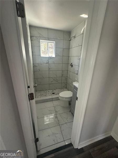 3005 Margaret Dr, Macon, GA 31206 - full bathroom featuring toilet, marble look tiles, a shower stall, and vanity