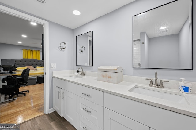 6851 Roswell Rd Unit E4, Sandy Springs, GA 30328 - bathroom featuring double vanity, wood finished floors, and recessed lighting