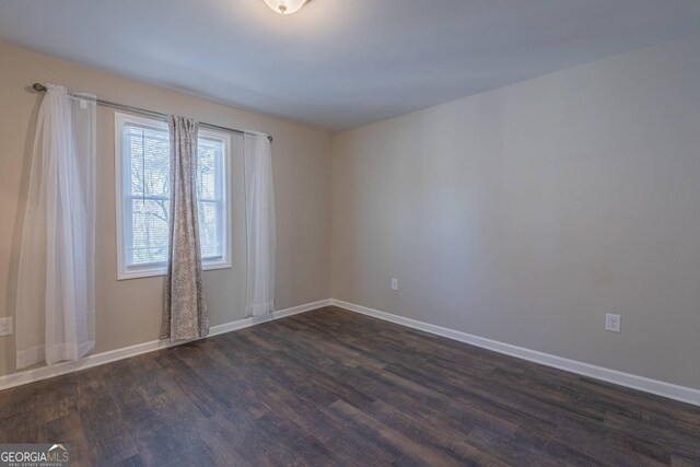 3107 Hendrix Cir SW, Covington, GA 30014 - unfurnished room featuring dark wood finished floors and baseboards