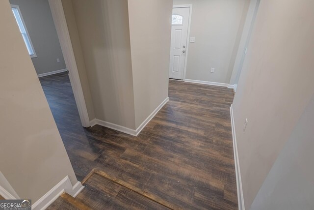 3107 Hendrix Cir SW, Covington, GA 30014 - hall featuring dark wood finished floors and baseboards