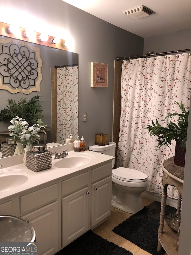 3692 Ramsey Cir, Atlanta, GA 30331 - full bath with toilet, double vanity, tile patterned flooring, and curtained shower