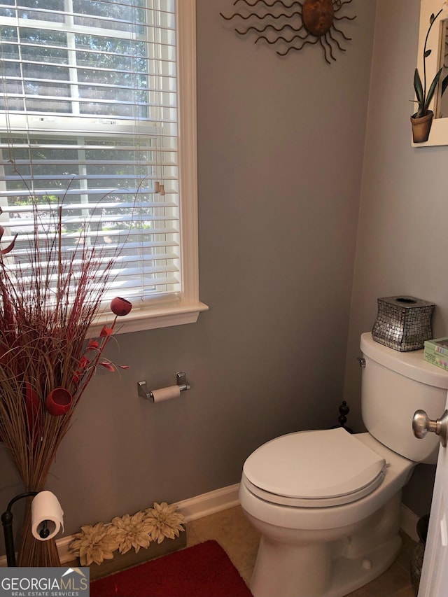 3692 Ramsey Cir, Atlanta, GA 30331 - bathroom with toilet, tile patterned floors, and baseboards
