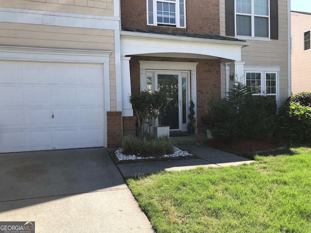 3692 Ramsey Cir, Atlanta, GA 30331 - view of exterior entry with brick siding and concrete driveway