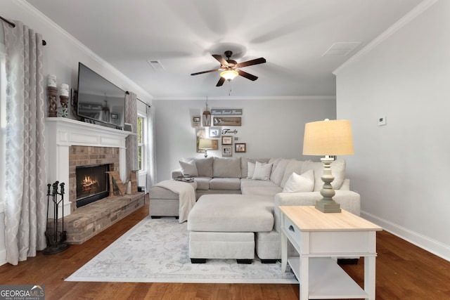 1412 Short Ct, Mcdonough, GA 30252 - living room featuring ceiling fan, wood finished floors, baseboards, ornamental molding, and a fireplace