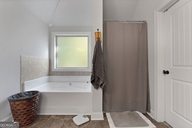 1412 Short Ct, Mcdonough, GA 30252 - full bathroom featuring a bath, a shower with shower curtain, and vaulted ceiling