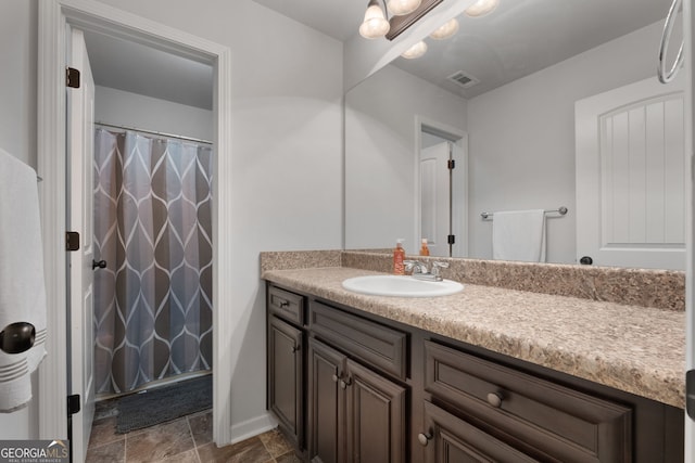 1412 Short Ct, Mcdonough, GA 30252 - bathroom featuring vanity, a shower with shower curtain, and stone finish floors