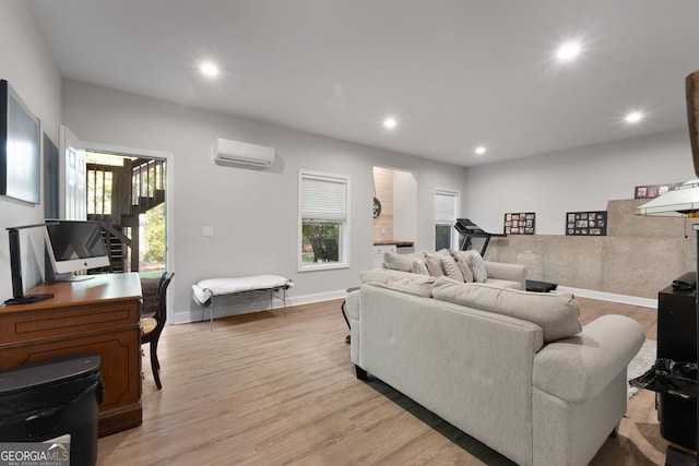 1412 Short Ct, Mcdonough, GA 30252 - living room featuring an AC wall unit, recessed lighting, light wood-style flooring, and baseboards