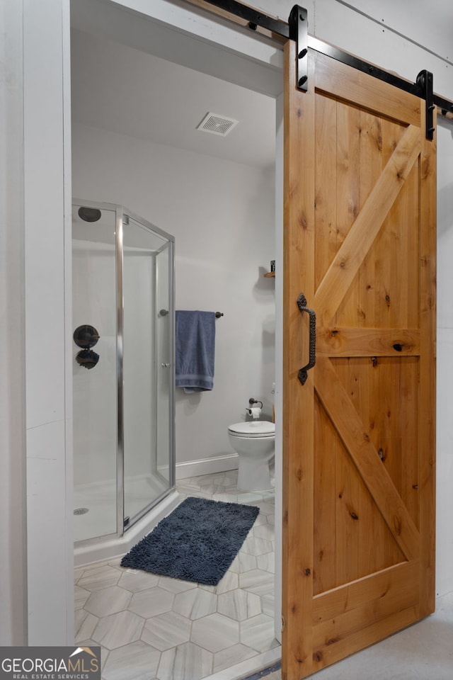1412 Short Ct, Mcdonough, GA 30252 - full bath with a stall shower, toilet, and baseboards