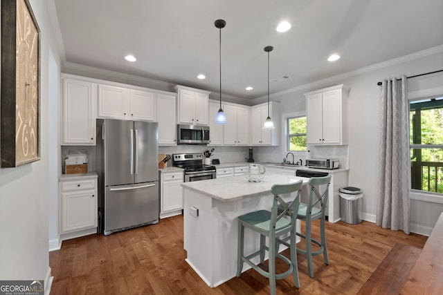 1412 Short Ct, Mcdonough, GA 30252 - kitchen featuring stainless steel appliances, a sink, backsplash, white cabinetry, and healthy amount of natural light