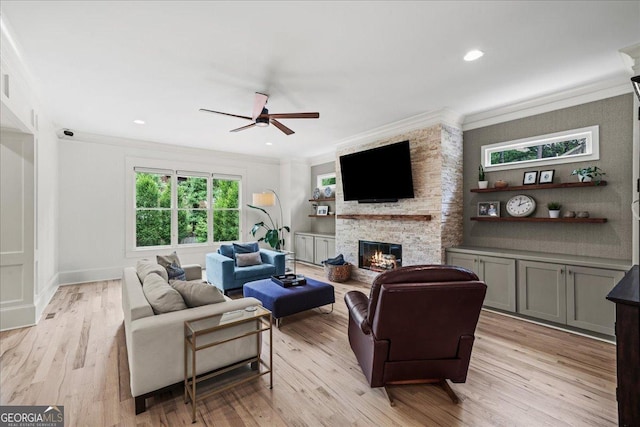 4048 Navajo Trl NE, Brookhaven, GA 30319 - living room featuring ornamental molding, ceiling fan, a fireplace, light wood-style flooring, and recessed lighting