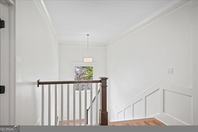 4048 Navajo Trl NE, Brookhaven, GA 30319 - staircase featuring ornamental molding, a decorative wall, and wainscoting