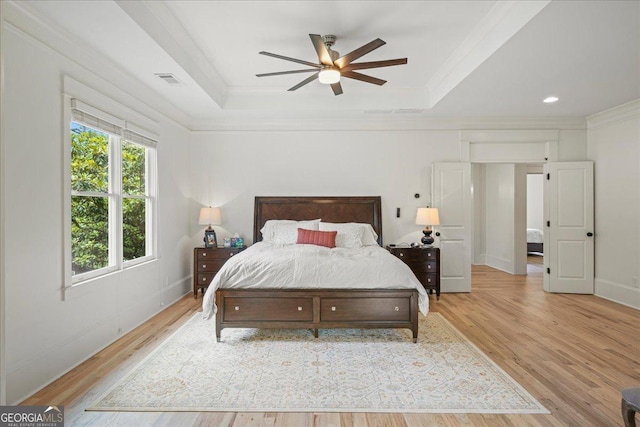 4048 Navajo Trl NE, Brookhaven, GA 30319 - bedroom featuring a tray ceiling, light wood-type flooring, ornamental molding, recessed lighting, and baseboards