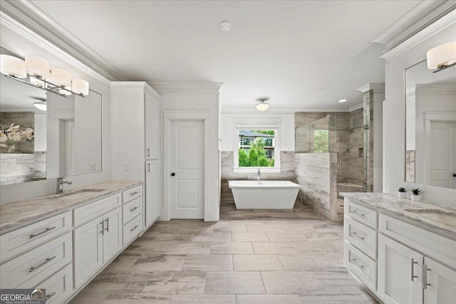 4048 Navajo Trl NE, Brookhaven, GA 30319 - full bath with ornamental molding, a shower stall, two vanities, a freestanding bath, and tile walls
