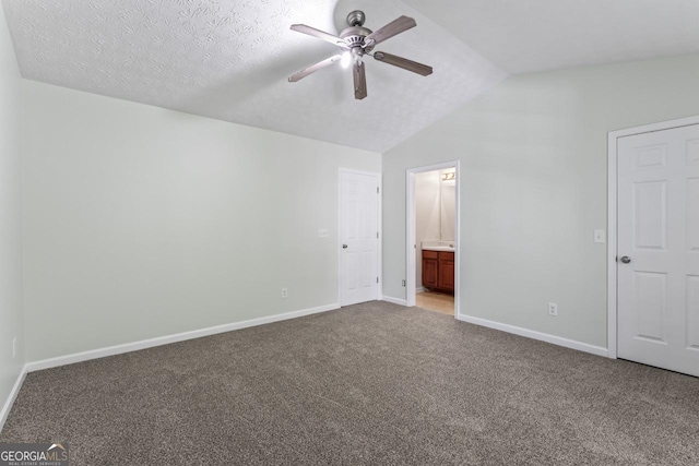 11439 S Grove Dr, Hampton, GA 30228 - unfurnished bedroom with lofted ceiling, carpet flooring, baseboards, ensuite bath, and a ceiling fan