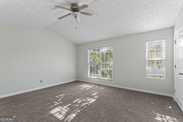 11439 S Grove Dr, Hampton, GA 30228 - empty room featuring healthy amount of natural light, a textured ceiling, baseboards, ceiling fan, and lofted ceiling