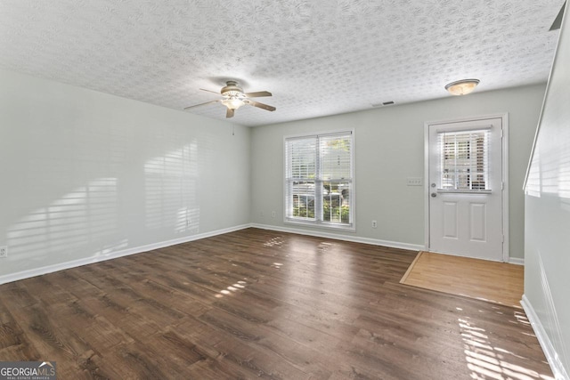 11439 S Grove Dr, Hampton, GA 30228 - entrance foyer featuring a ceiling fan, wood finished floors, and baseboards