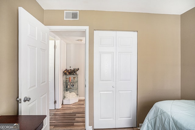 992 Brian Ln, Forest Park, GA 30297 - bedroom with dark wood-type flooring and a closet