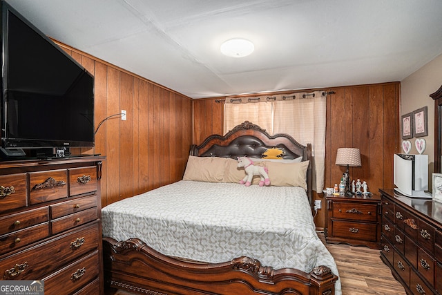 992 Brian Ln, Forest Park, GA 30297 - bedroom featuring wooden walls and wood finished floors